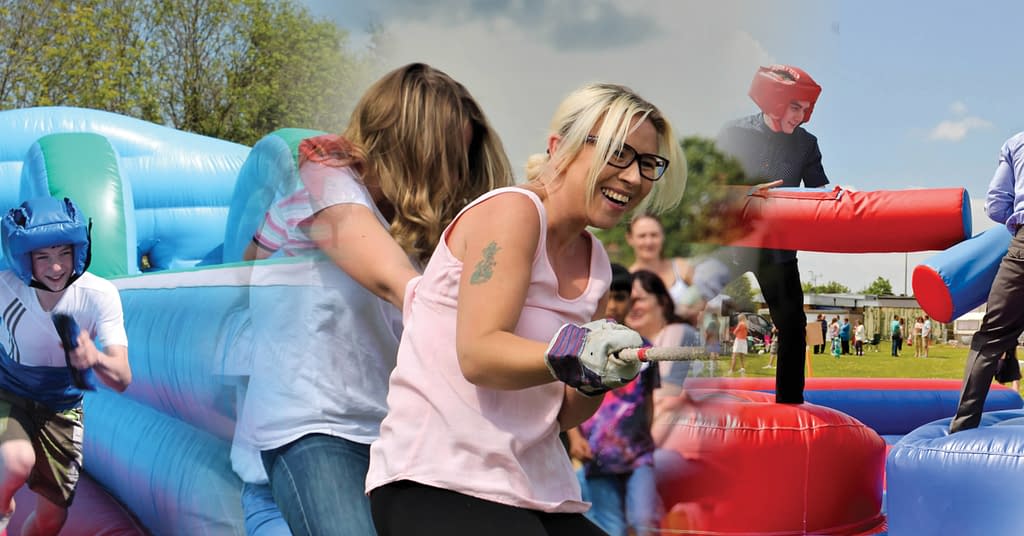 A picture containing person, outdoor, playground, crowd Description automatically generated