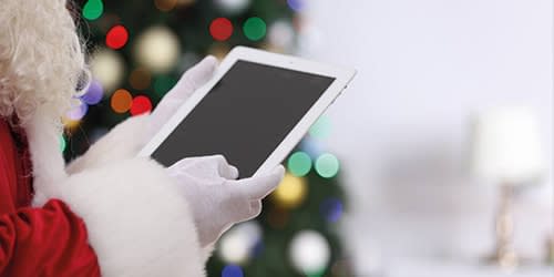 Santa holding an iPad