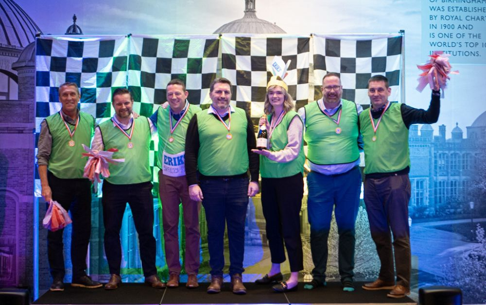 Winning team collecting medals in indoor team building activity