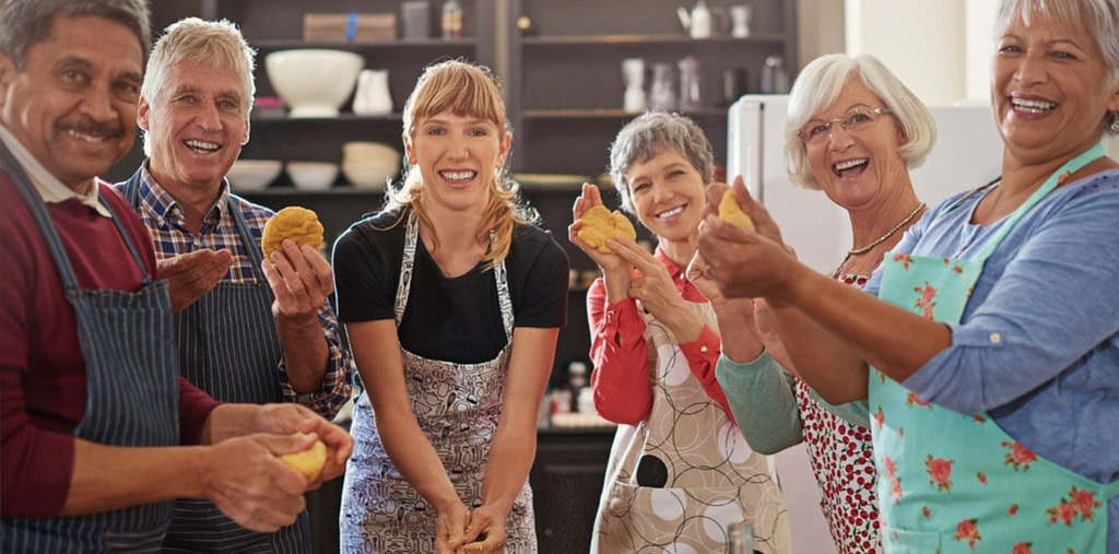 men and women holding vegetables