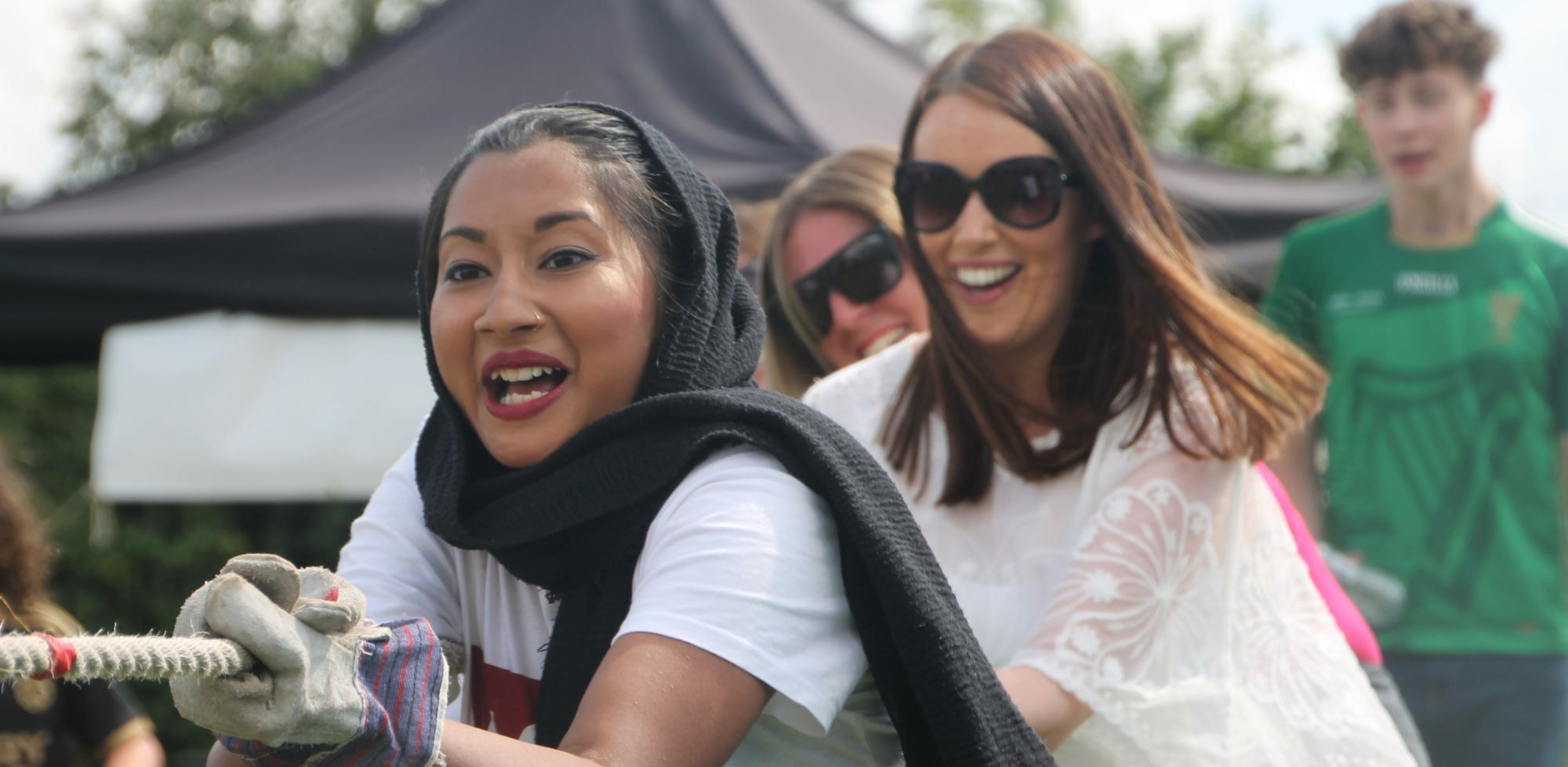 Team playing tug of war