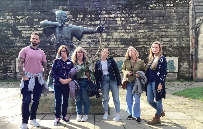 Group posing by Robin Hood statue in Nottingham